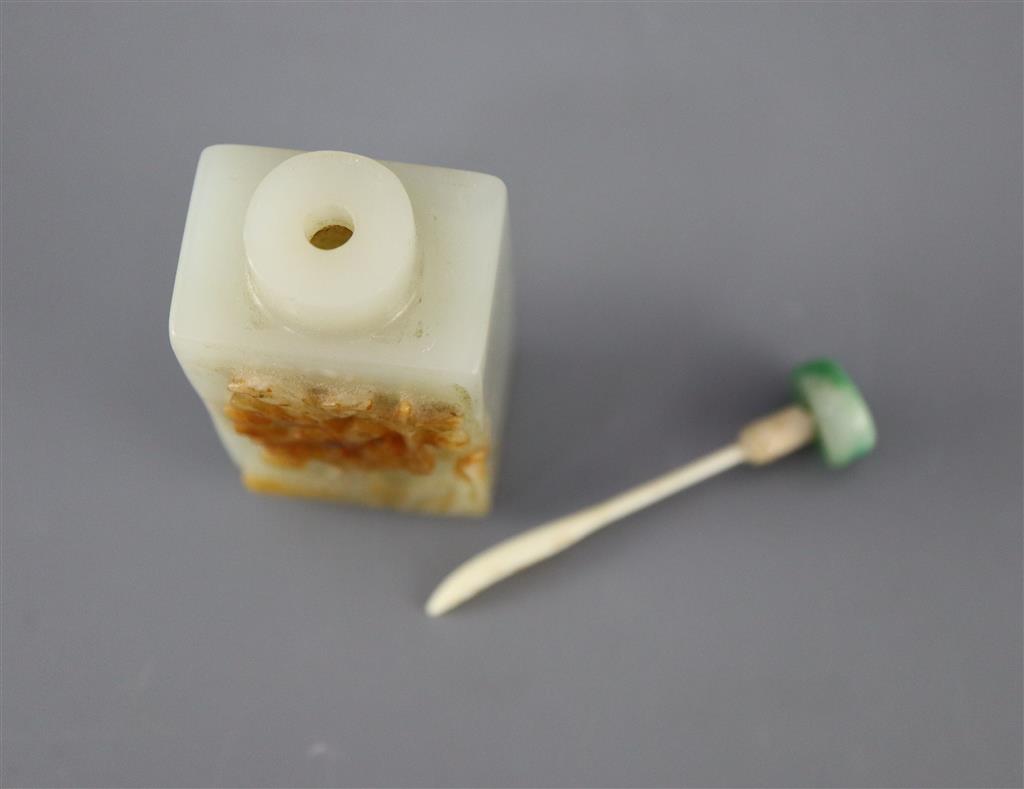 A Chinese pale celadon and russet jade rectangular snuff bottle, 19th century, 5.7cm excl. stopper